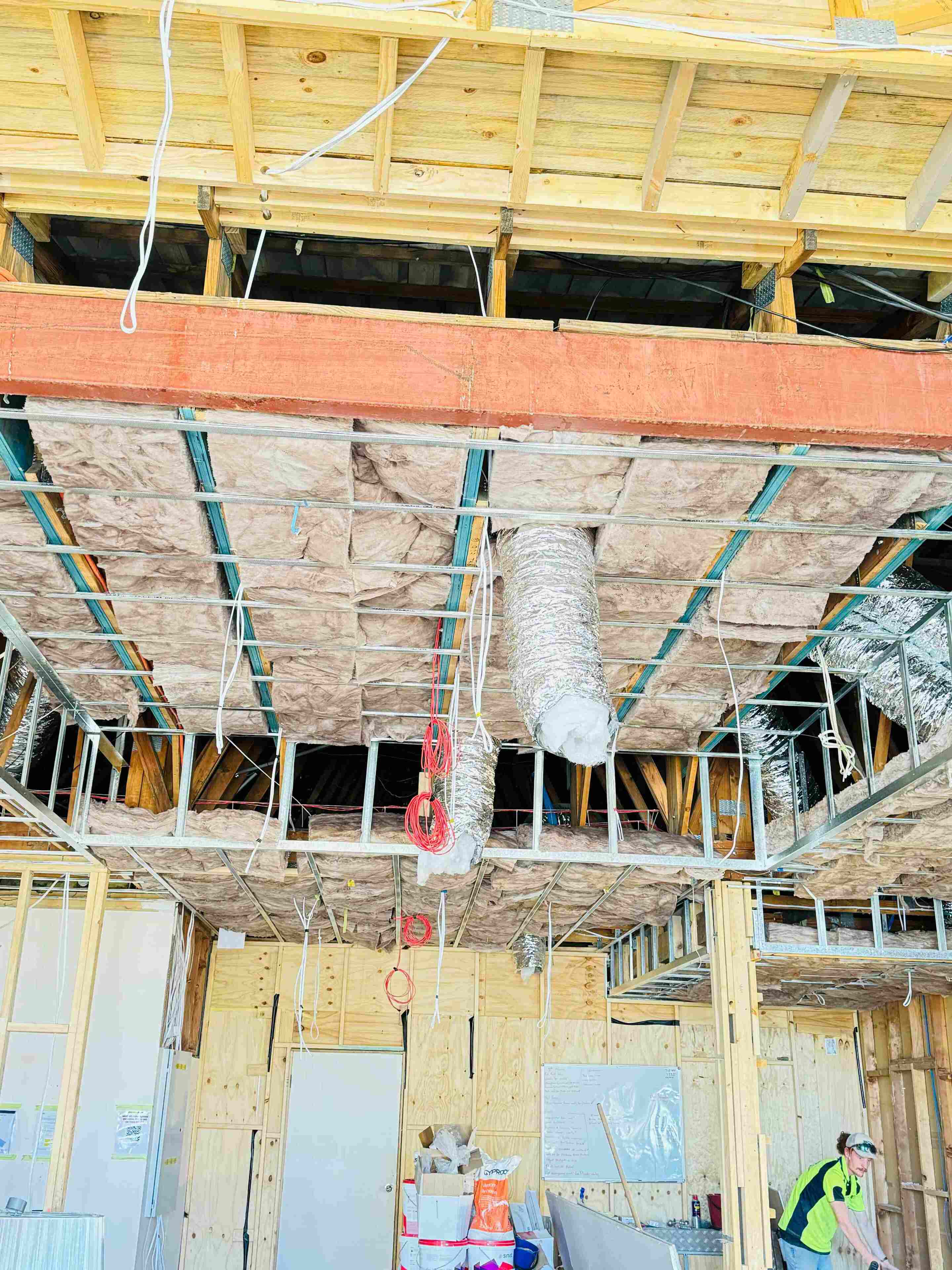 Glasswool ceiling insulation fitted beneath roof framing