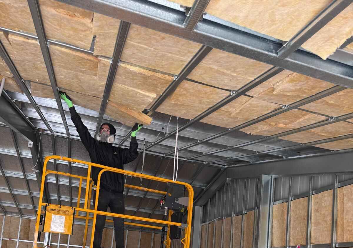 Insulation installed across a commercial ceiling